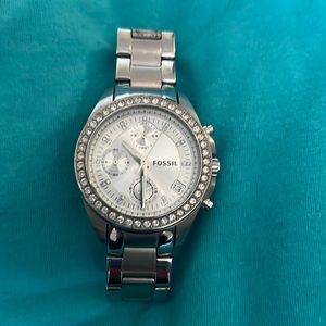 Silver fossil watch with extra links for sizing